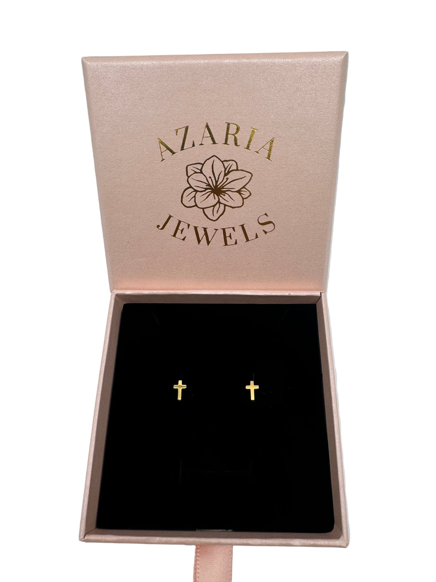 Rose gold jewelry box with 'Azaria Jewels' branding and a pair of gold earrings.